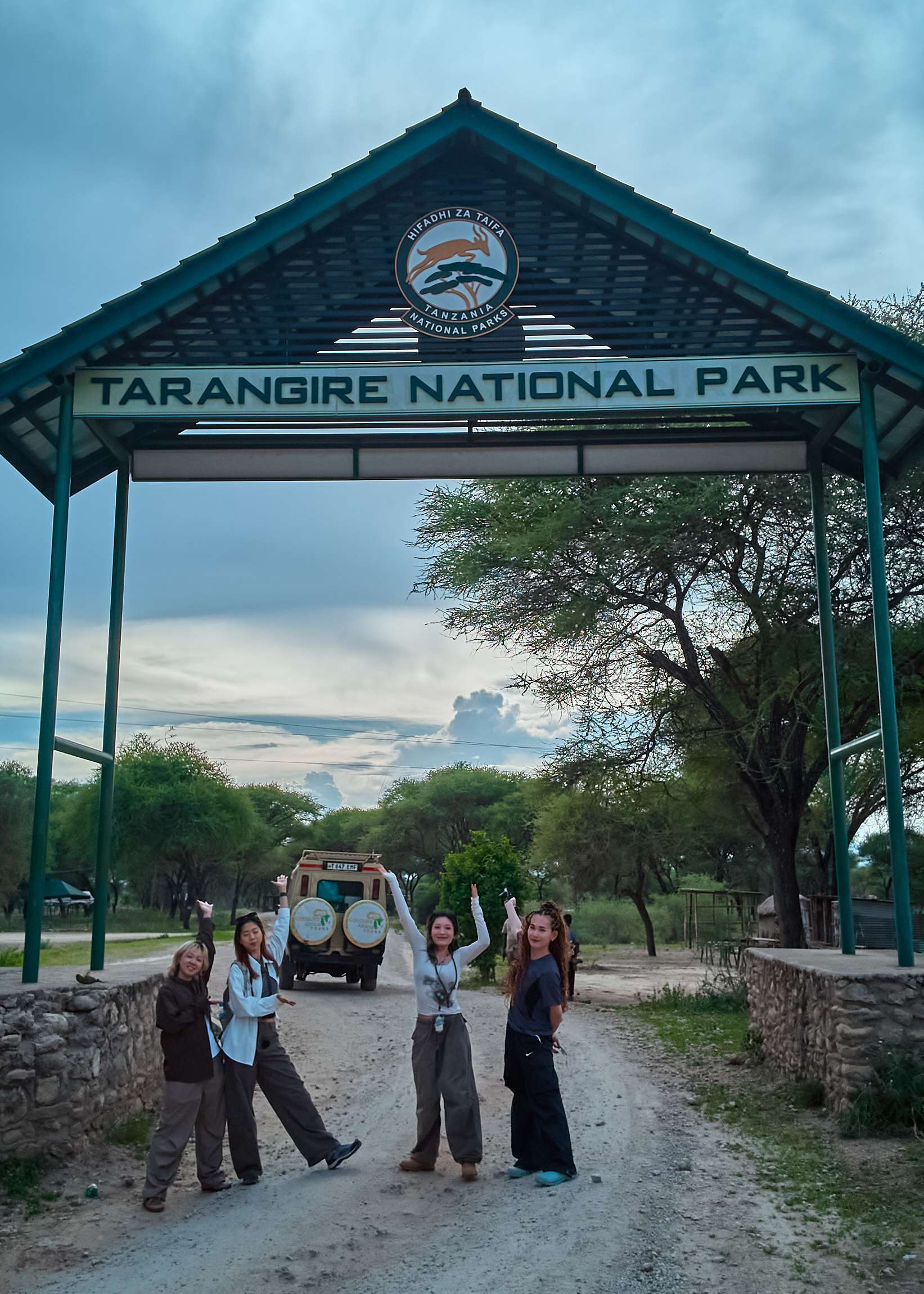 Tarangire National Park entrance gate with safari visitors arriving in Tanzania