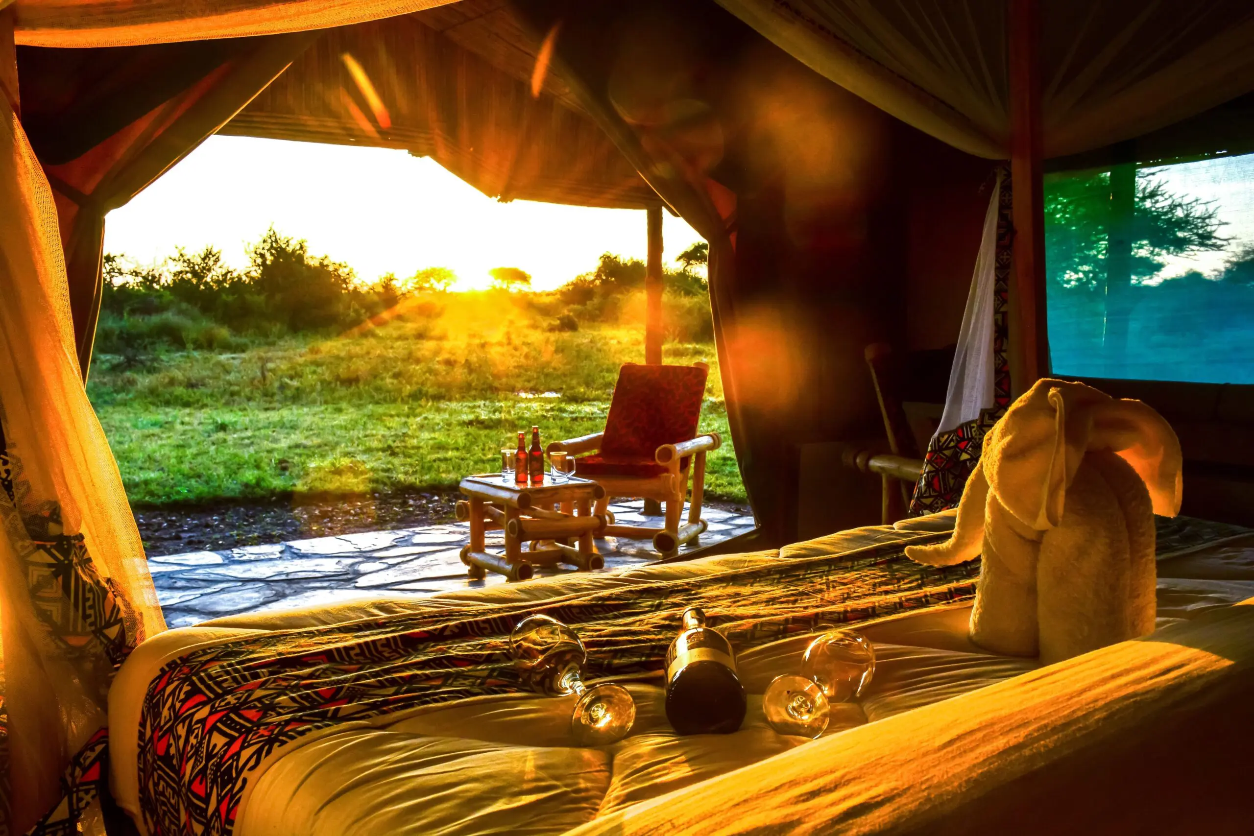 Safari Comfort Room at Africa Safari Serengeti Ikoma featuring a king-size bed, private balcony, and stunning Serengeti views
