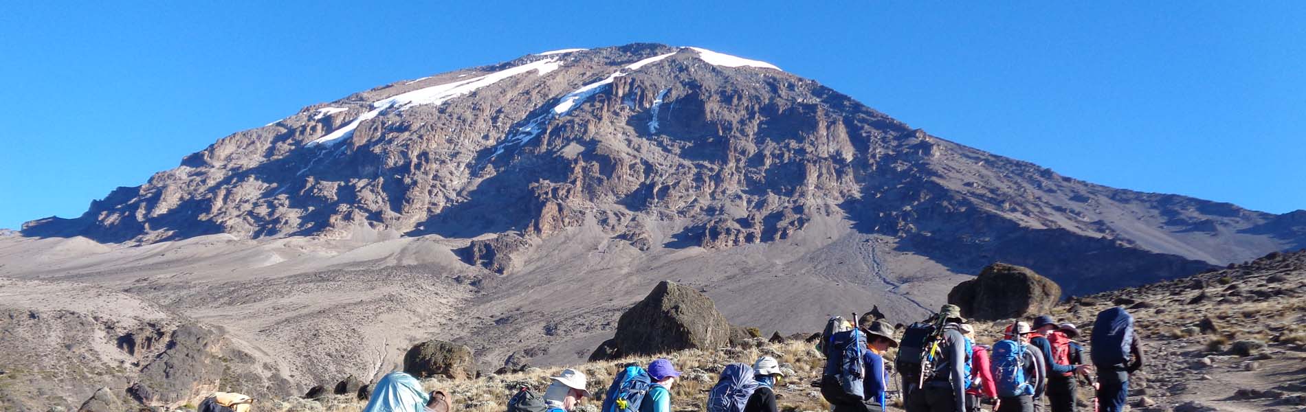 Hikers trekking the remote Northern Circuit Route