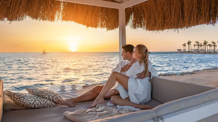 Couple enjoying a 6-Day Luxury Honeymoon Safari in Tanzania during a game drive in Serengeti and Ngorongoro