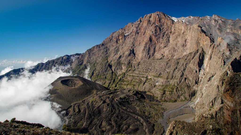 Mount Meru Trek Guide showing hikers climbing Mount Meru in Arusha National Park